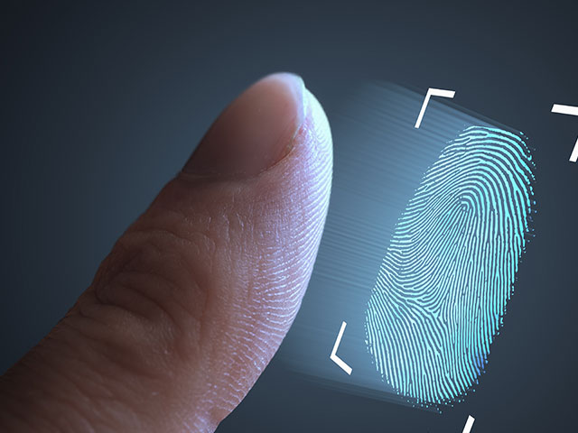 Finger with digital fingerprint being taken